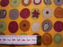 Sweatshirtstoff orange mit verschiedenfarbigen Kreisen und Motiven