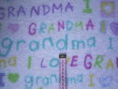 Fleecestoff weiß mit Schrift in pink grün lila gelb und türkis